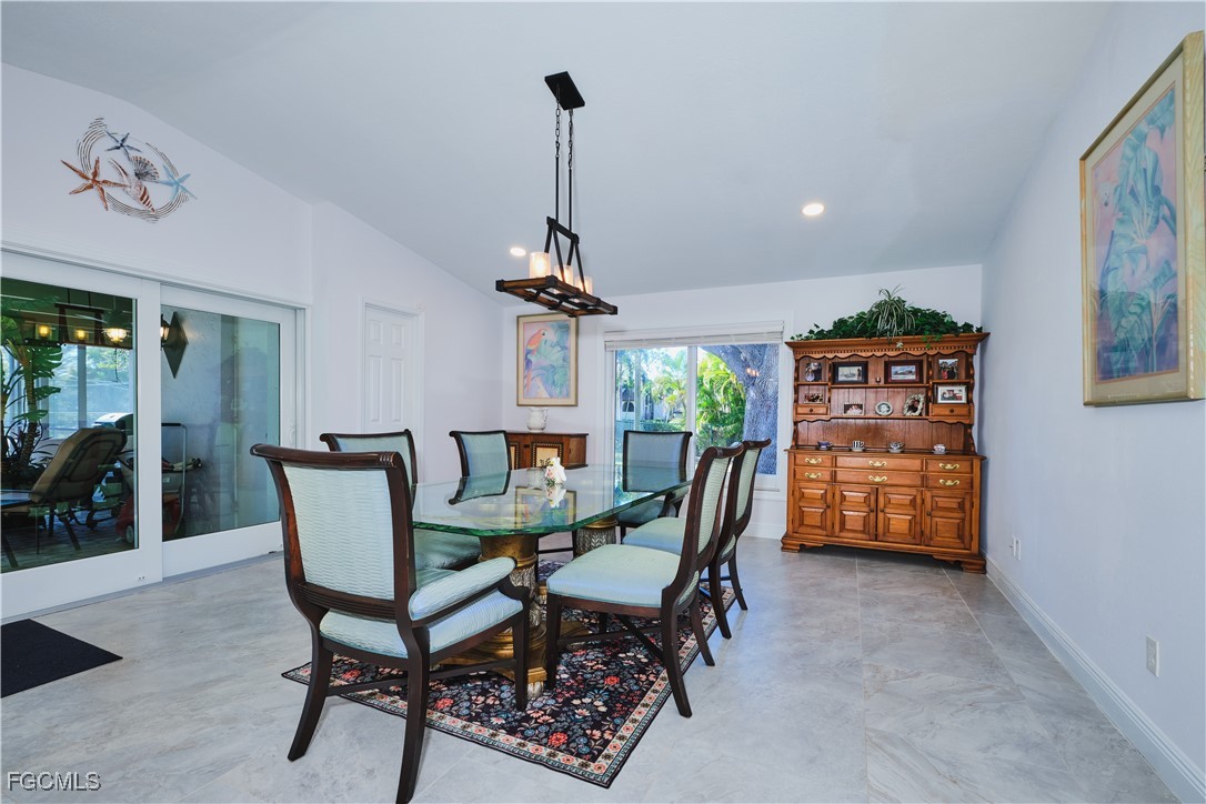 3644 Putter Point Lane Fort Myers, FL 33919 - Photo 23 of 50 a dining room with furniture and window