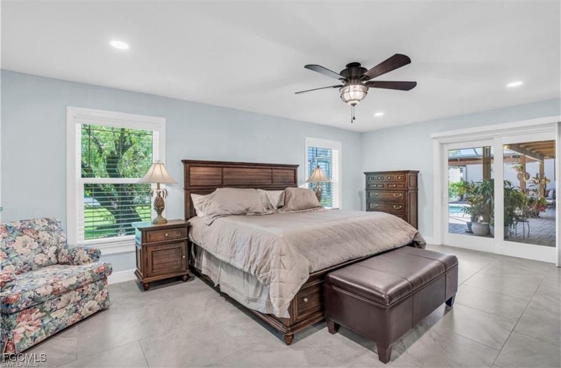 3644 Putter Point Lane Fort Myers, FL 33919 - Photo 25 of 50 a spacious bedroom with a bed and window