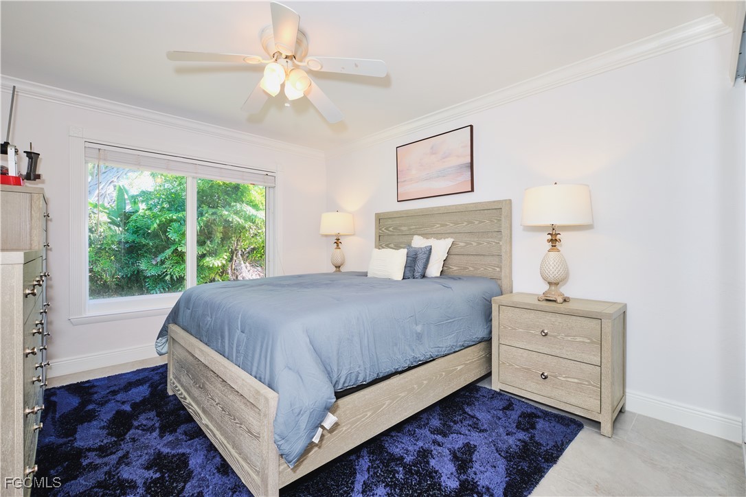 3644 Putter Point Lane Fort Myers, FL 33919 - Photo 32 of 50 a bedroom with a bed and a window