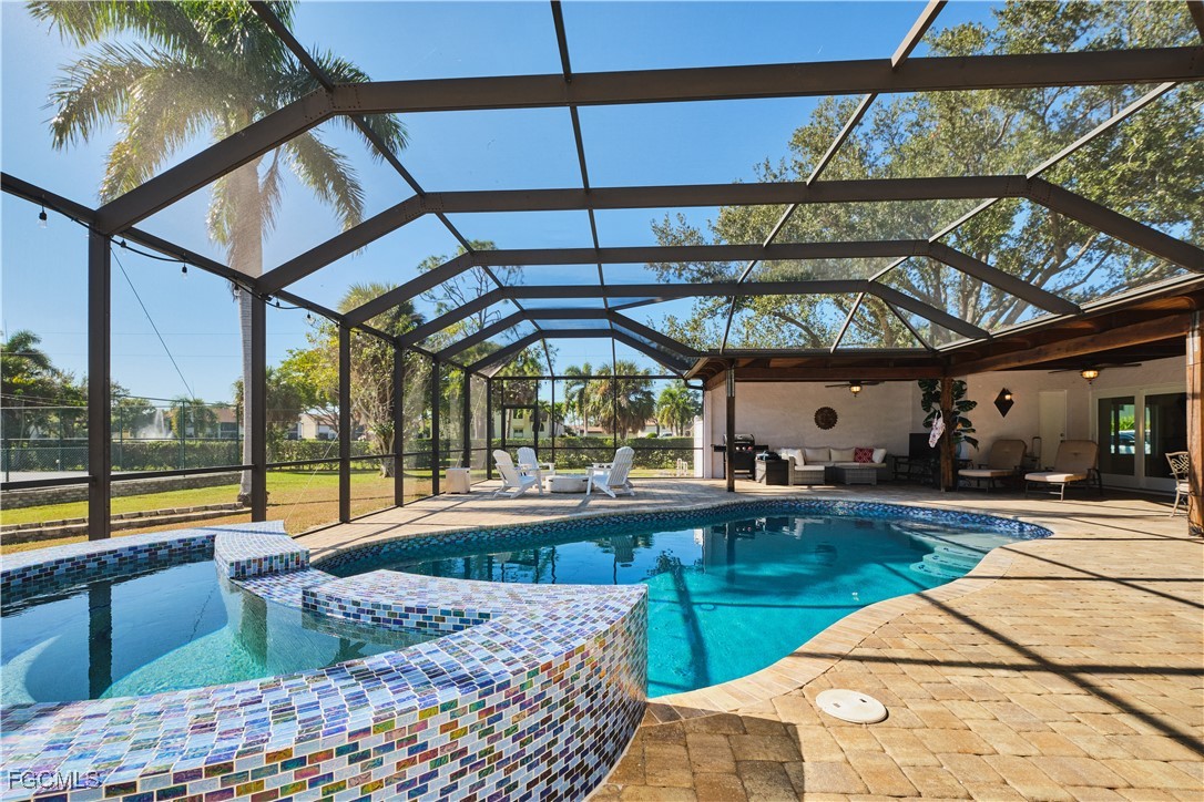 3644 Putter Point Lane Fort Myers, FL 33919 - Photo 42 of 50 a view of swimming pool with a patio and a yard