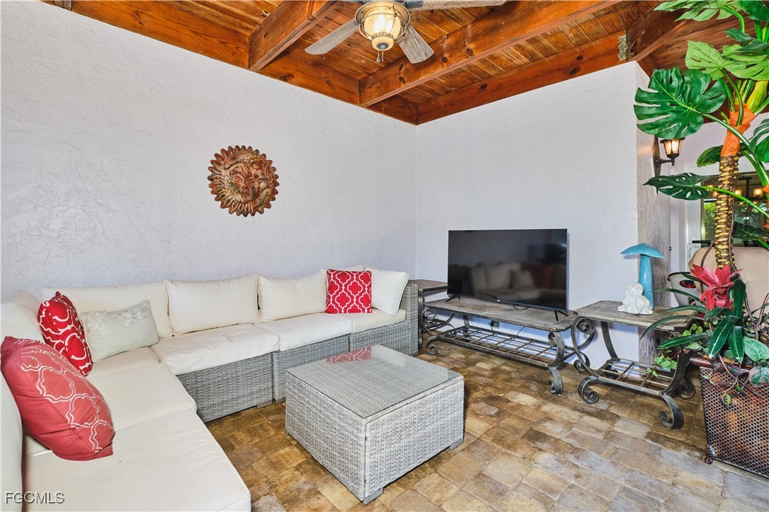 3644 Putter Point Lane Fort Myers, FL 33919 - Photo 44 of 50 a living room with furniture and a flat screen tv