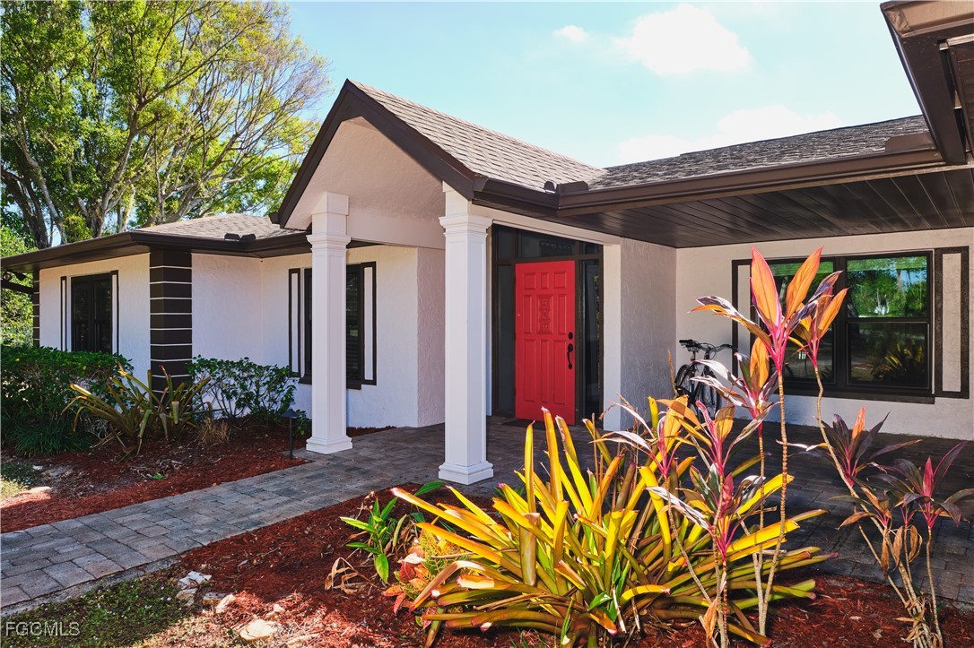 3644 Putter Point Lane Fort Myers, FL 33919 - Photo 8 of 50 a front view of a house with a porch