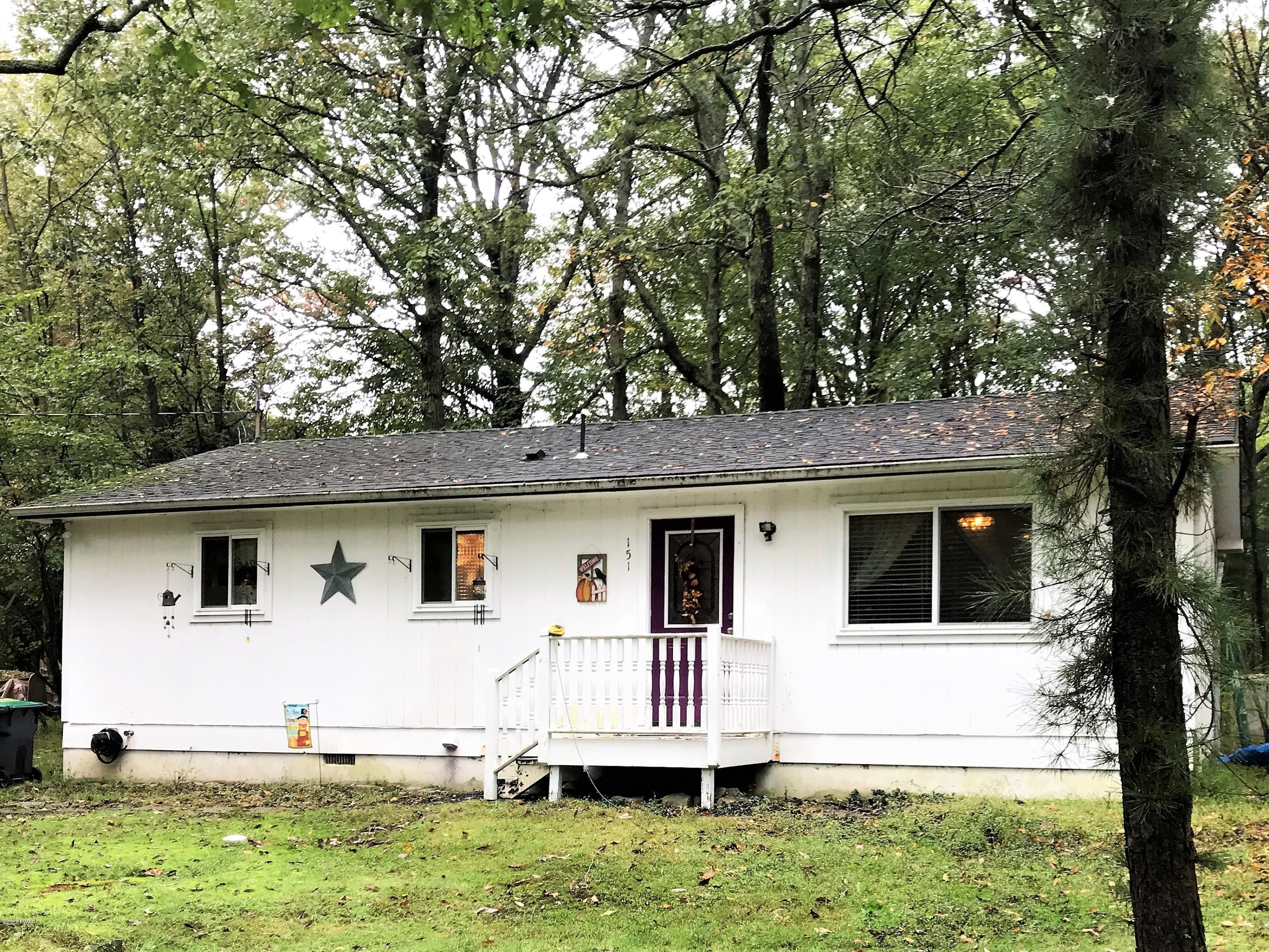 151 Raccoon Road Dingmans Ferry, PA 18328 - Photo 28 of 29 a front view of a house with a yard