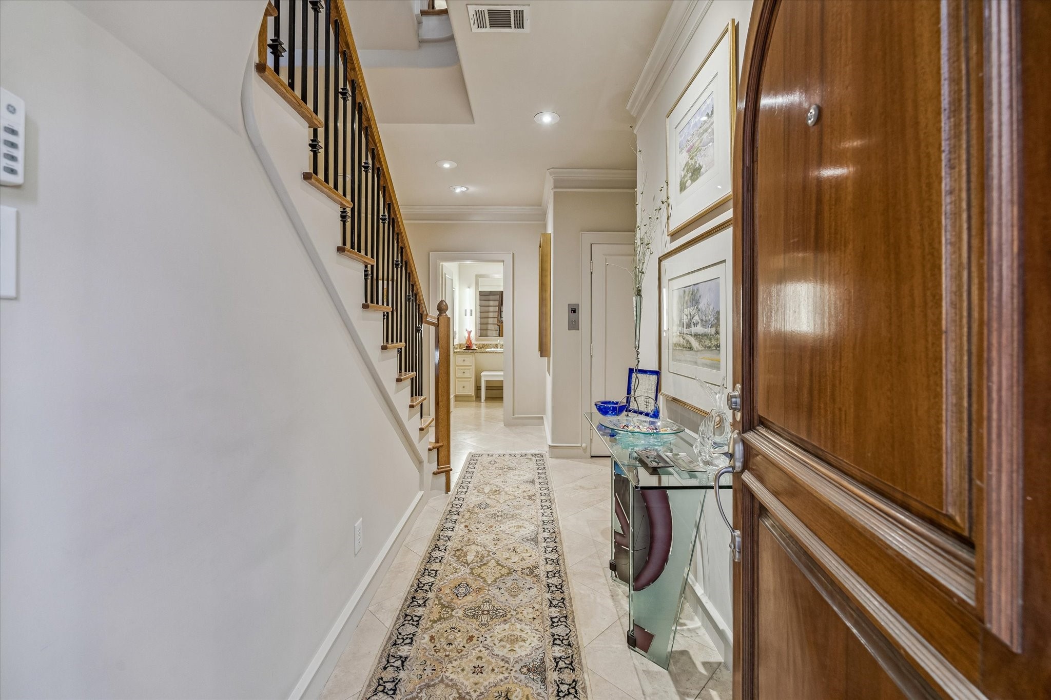 2415 West Main Street Houston, TX 77098 - Photo 12 of 48 Welcome Home... From the moment you enter, the property reveals a deliberate fusion of elegance, comfort, and thoughtful accessibility—creating a living environment that feels both indulgent and effortlessly functional.