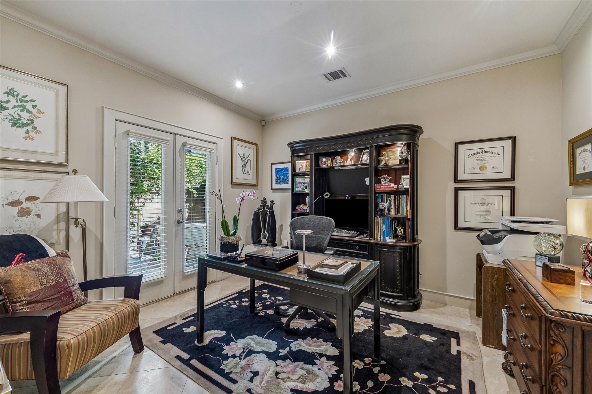 2415 West Main Street Houston, TX 77098 - Photo 14 of 48 Study/Bedroom... This flexible study or bedroom showcases sophisticated travertine flooring, sleek two-inch privacy blinds, and soft recessed lighting that enhances the room’s warm, refined ambiance.
