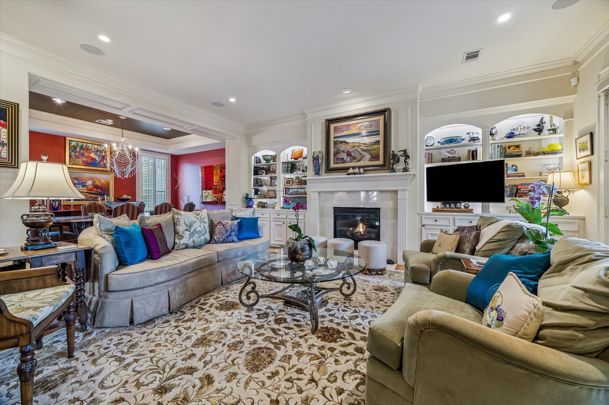 2415 West Main Street Houston, TX 77098 - Photo 2 of 48 Formal Living Room... Rich hardwoods, exquisite millwork, and curated upscale finishes create elevated elegance, while designer lighting enhances sightlines and adds warm, inviting ambiance.