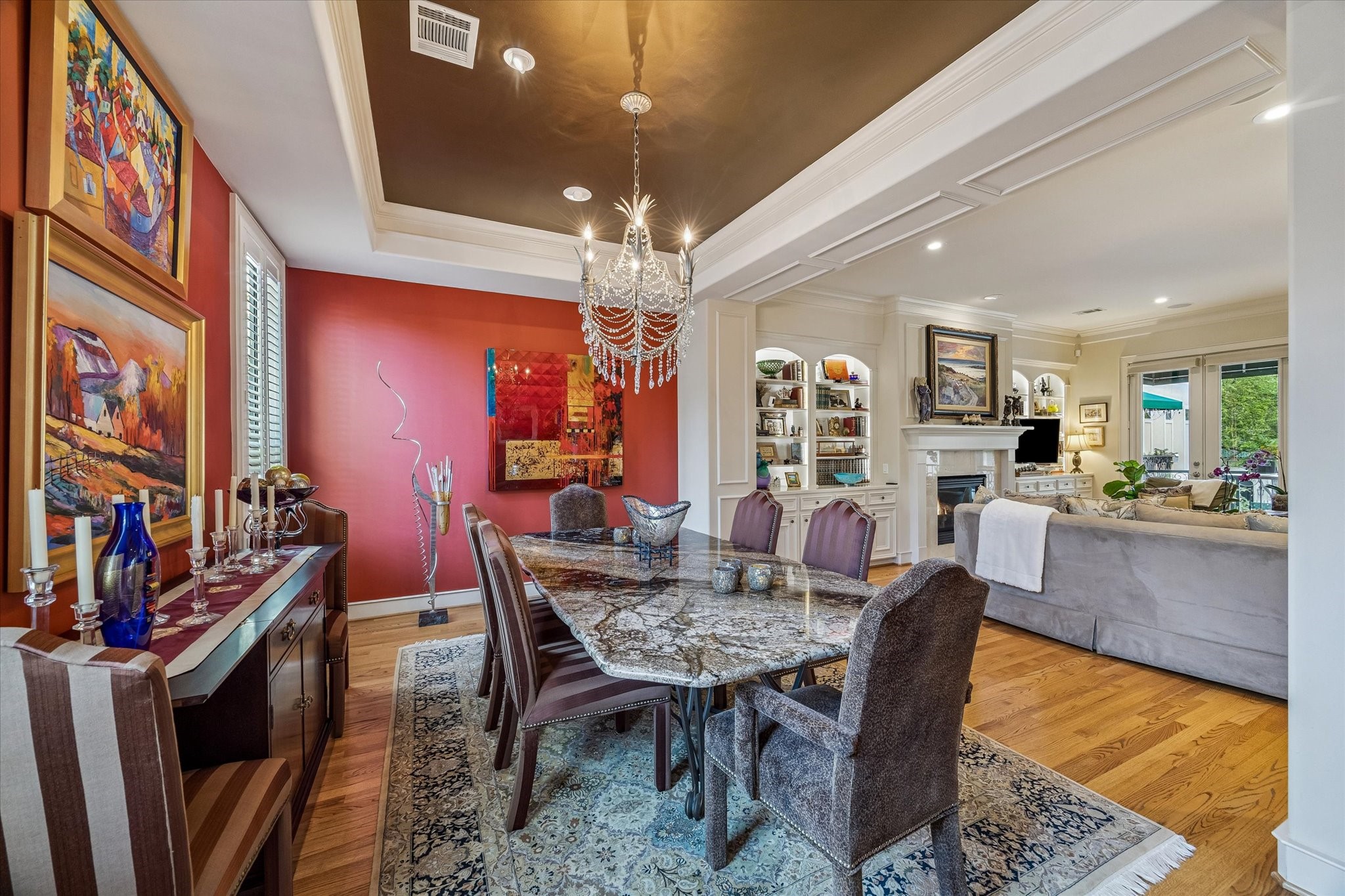 2415 West Main Street Houston, TX 77098 - Photo 22 of 48 This additional view captures the formal dining room looking back toward the formal living area, emphasizing the graceful transition and sophisticated architectural continuity between the two spaces.