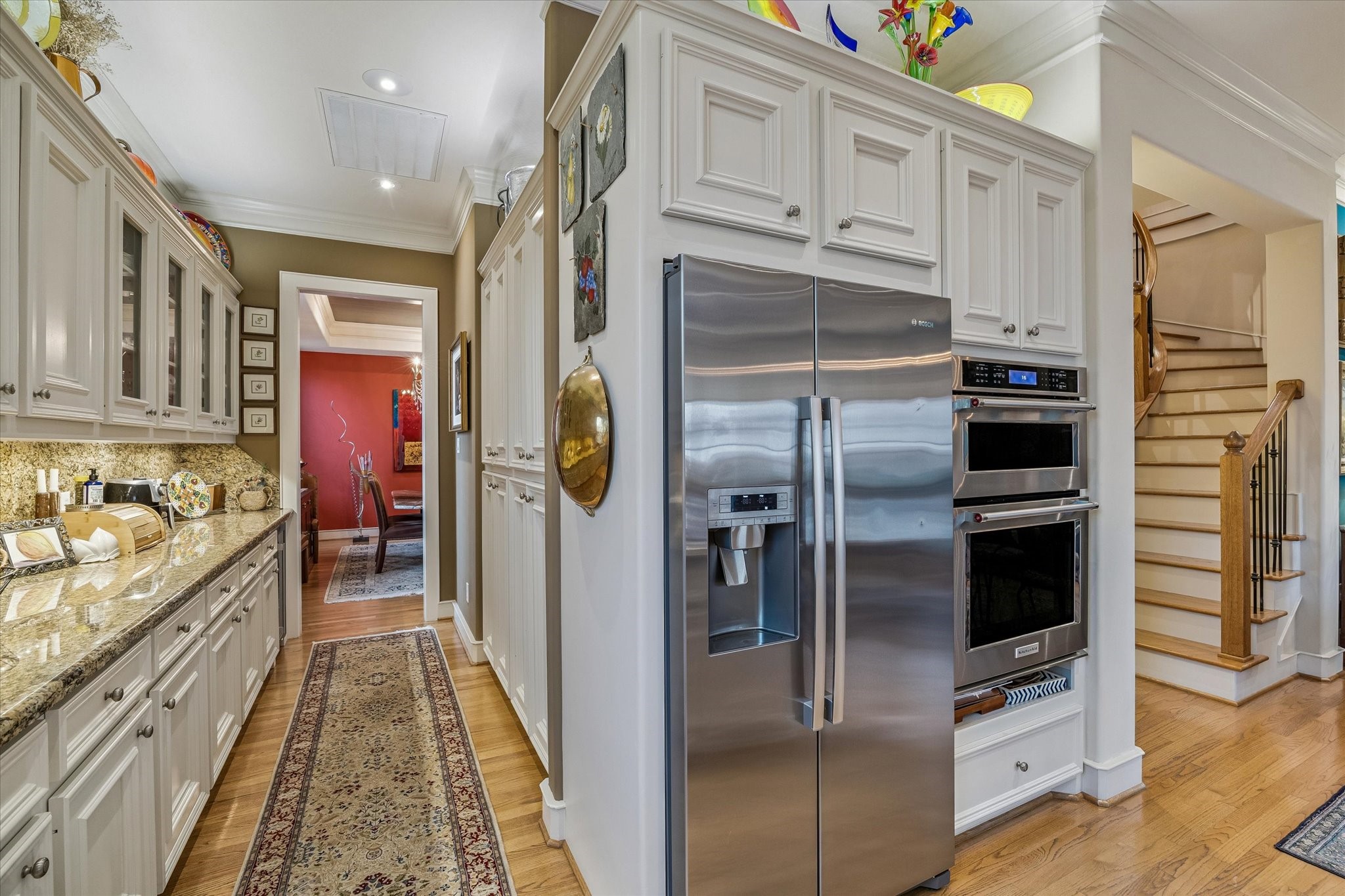 2415 West Main Street Houston, TX 77098 - Photo 27 of 48 The kitchen is outfitted with premium stainless appliances, including a Bosch 36'' fridge, Nfinity dual zone wine fridge, Bosch EcoSense dishwasher, & KitchenAid wall oven with built in microwave.