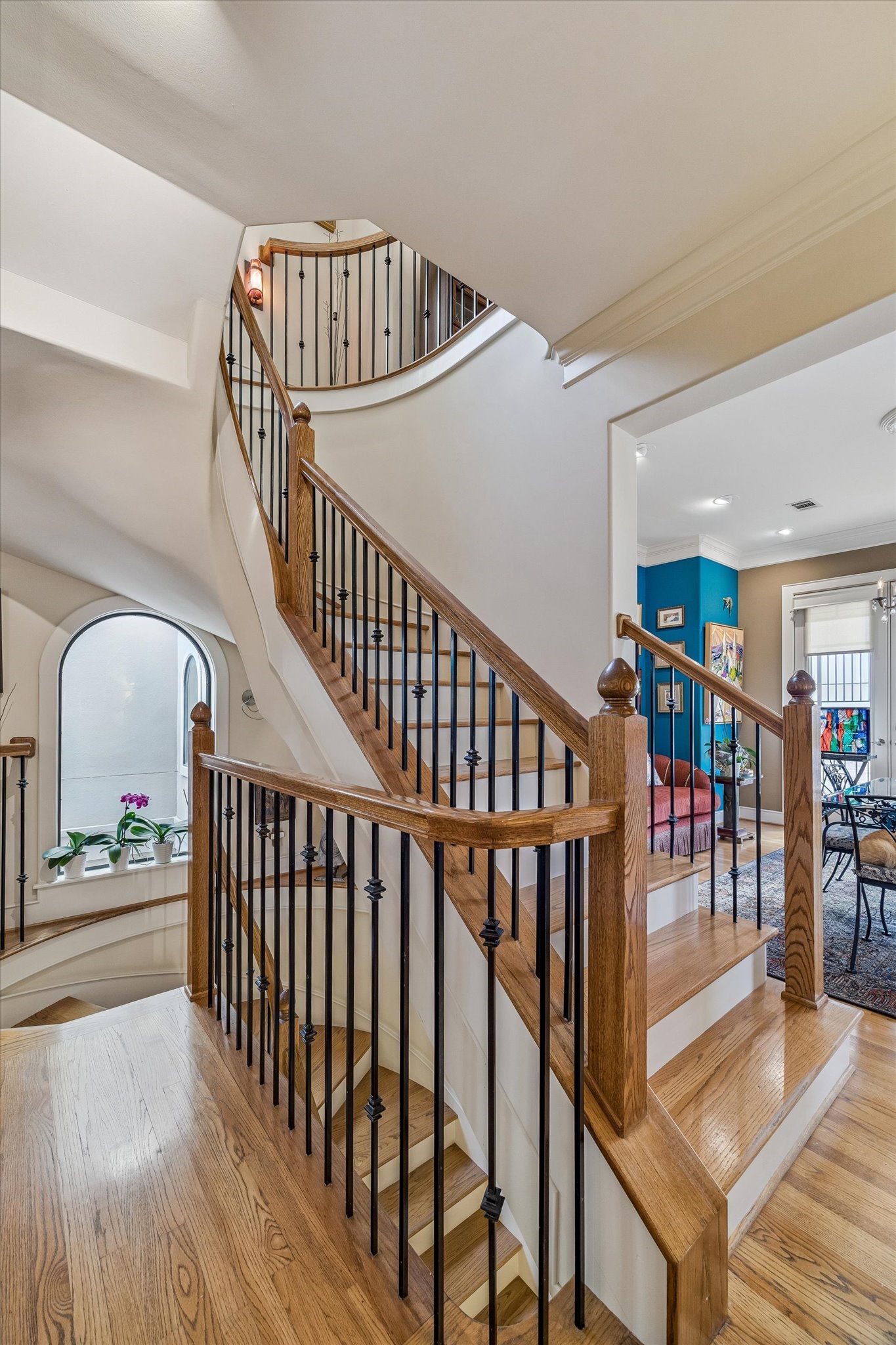 2415 West Main Street Houston, TX 77098 - Photo 30 of 48 A sweeping circular staircase serves all floors, enhanced by oversized windows at every level that bathe the space in abundant natural light and highlight its architectural elegance.