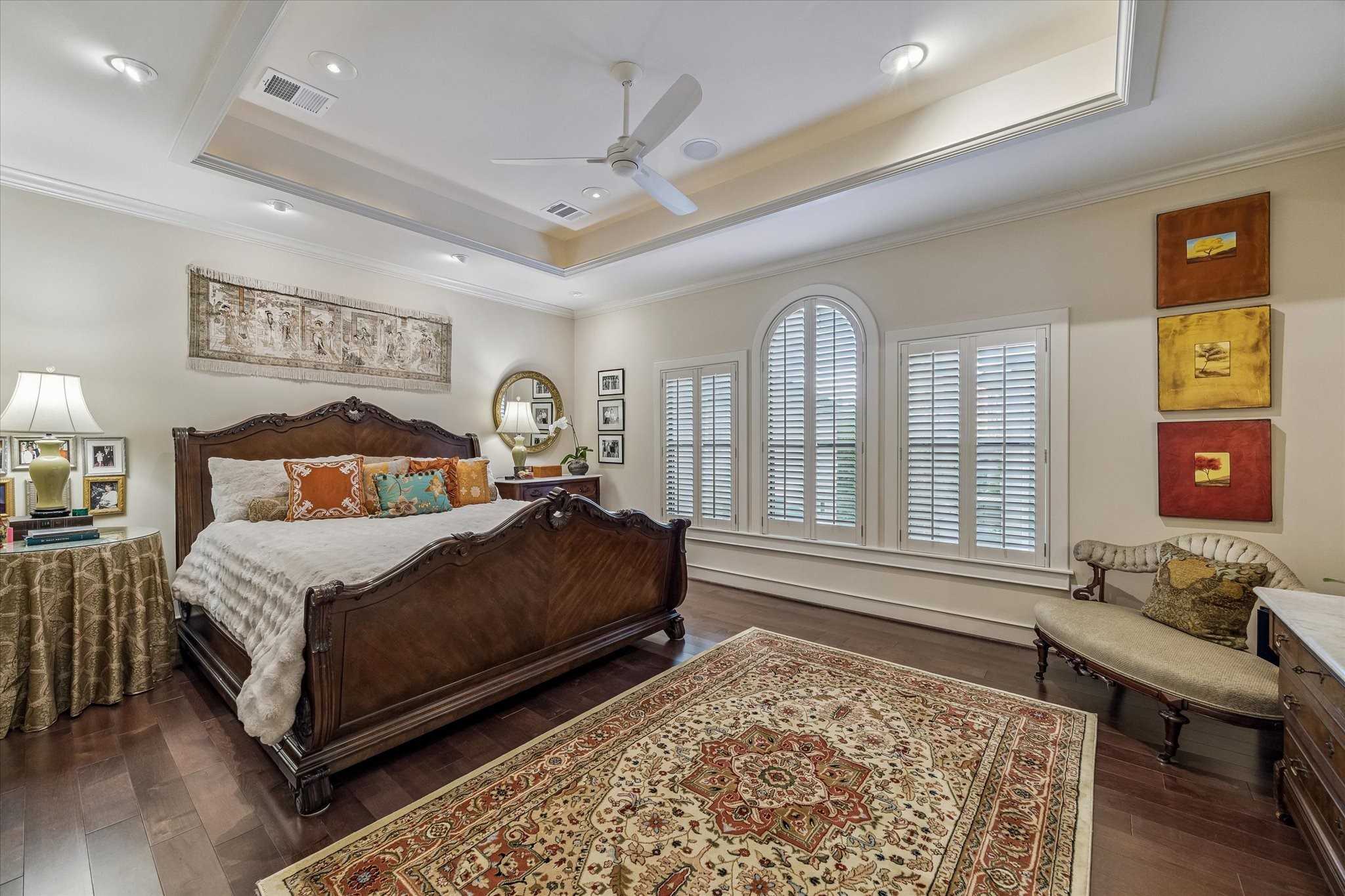 2415 West Main Street Houston, TX 77098 - Photo 33 of 48 Private Primary Retreat… Enter through a graceful rotunda with tray ceiling. Engineered hardwoods, plantation shutters, crown molding, and a wall of windows create a refined, light filled sanctuary.