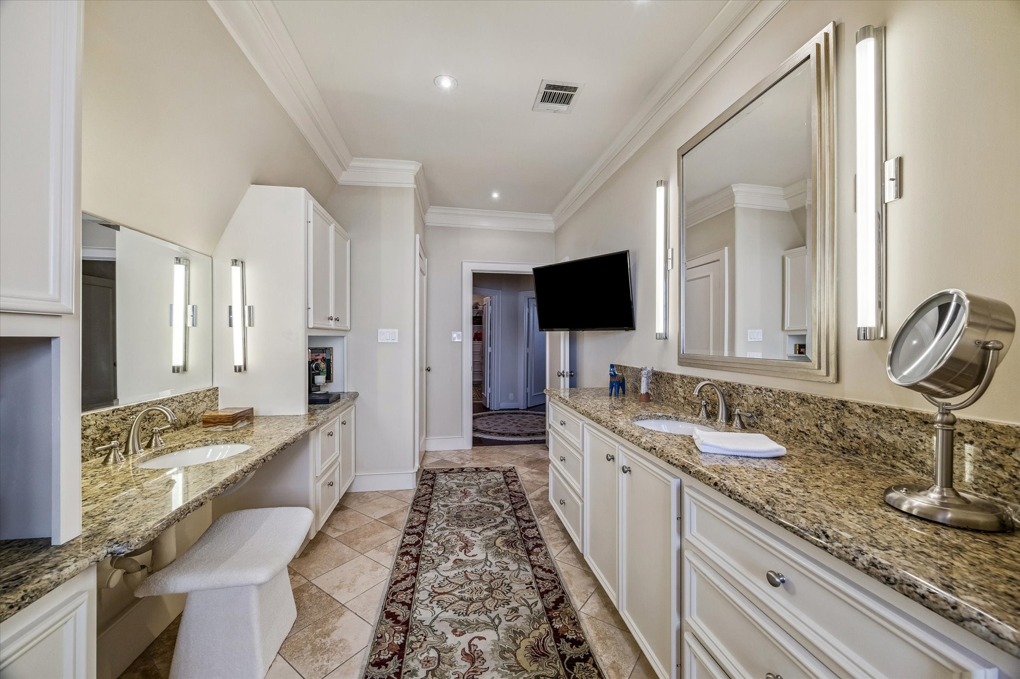 2415 West Main Street Houston, TX 77098 - Photo 35 of 48 Beautifully crafted custom built-ins provide expansive counter surfaces and ample cabinetry for sophisticated storage. A separate private water closet adds an additional layer of comfort and privacy to the space.