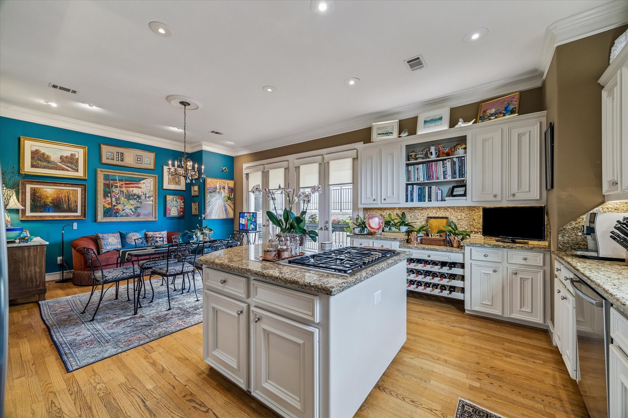 2415 West Main Street Houston, TX 77098 - Photo 5 of 48 The kitchen transitions gracefully into the breakfast area and family room, creating a sophisticated open concept space where cooking, dining, and relaxing blend effortlessly—perfect for modern luxury living.