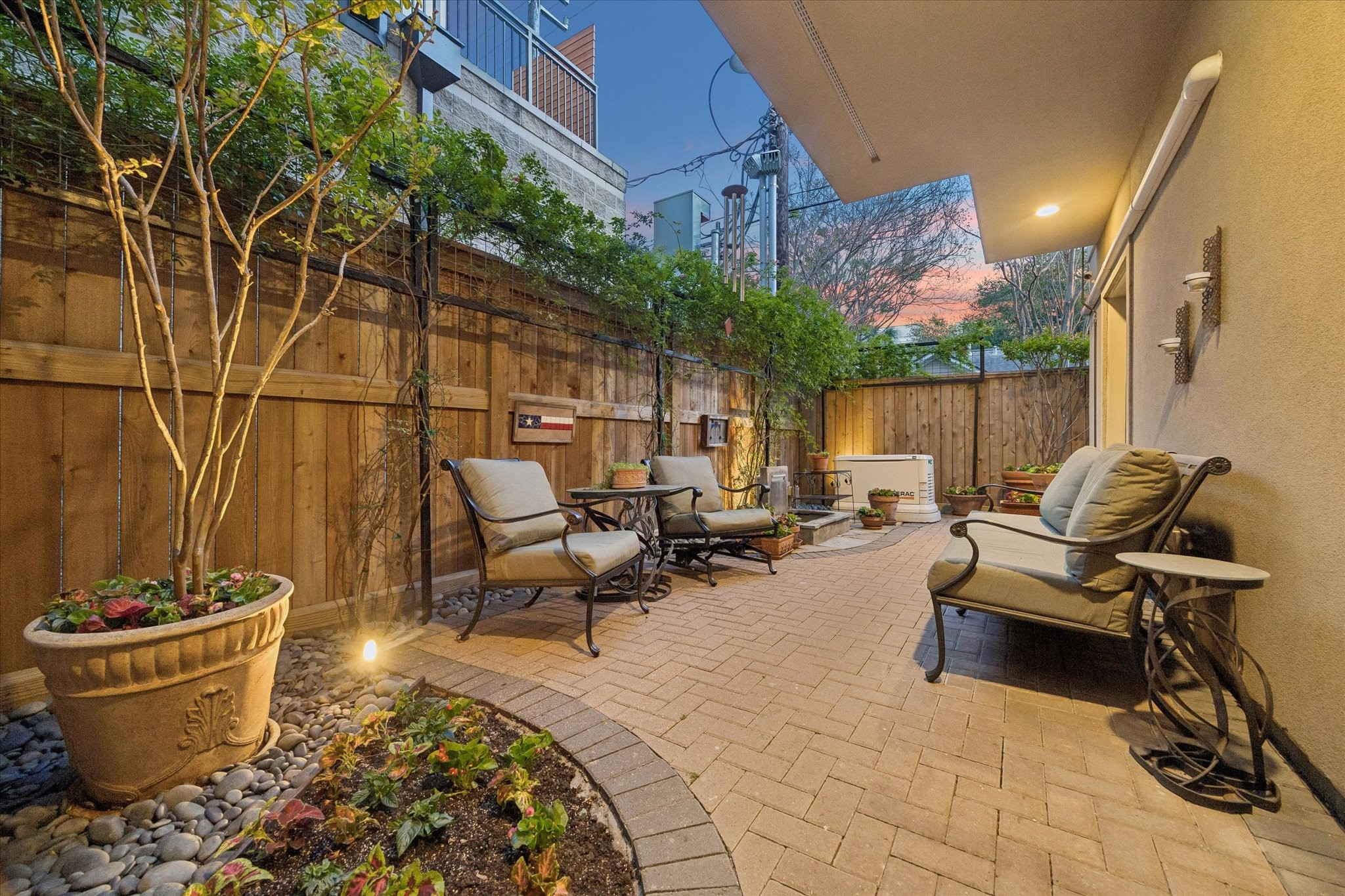 2415 West Main Street Houston, TX 77098 - Photo 6 of 48 Private outdoor patio... Ideal for relaxing or alfresco entertaining, supported by a zoned Trane HVAC system, Honeywell smart thermostats, and two mini-splits for optimal comfort throughout.