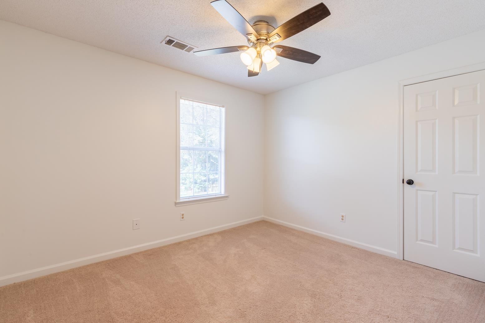 251 Cross Point Cove Collierville, TN 38017 - Photo 20 of 29 an empty room with a window and a fan
