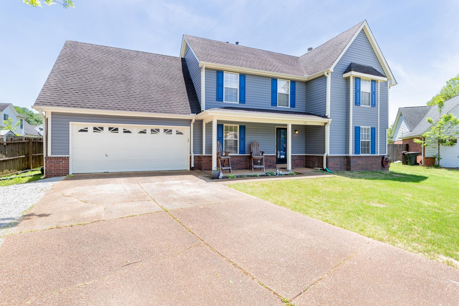 251 Cross Point Cove Collierville, TN 38017 - Photo 2 of 29 a view of a white house with a large pool lawn chairs and a yard