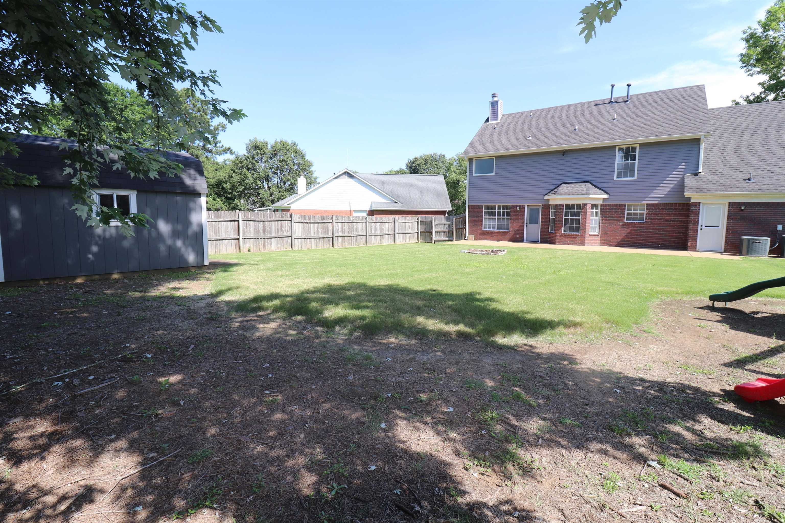 251 Cross Point Cove Collierville, TN 38017 - Photo 24 of 29 a view of a house with a yard