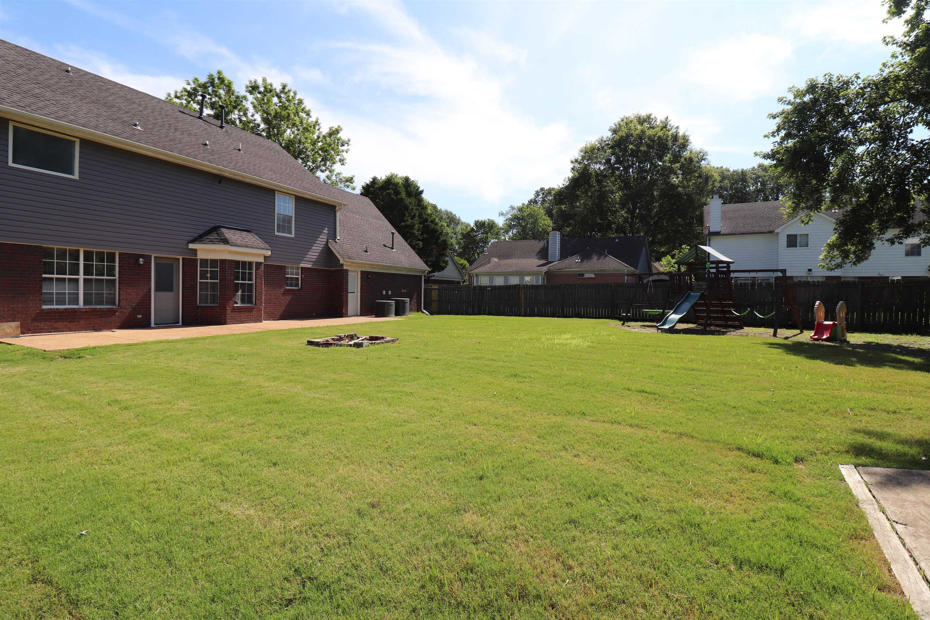 251 Cross Point Cove Collierville, TN 38017 - Photo 25 of 29 a front view of house with yard and trees