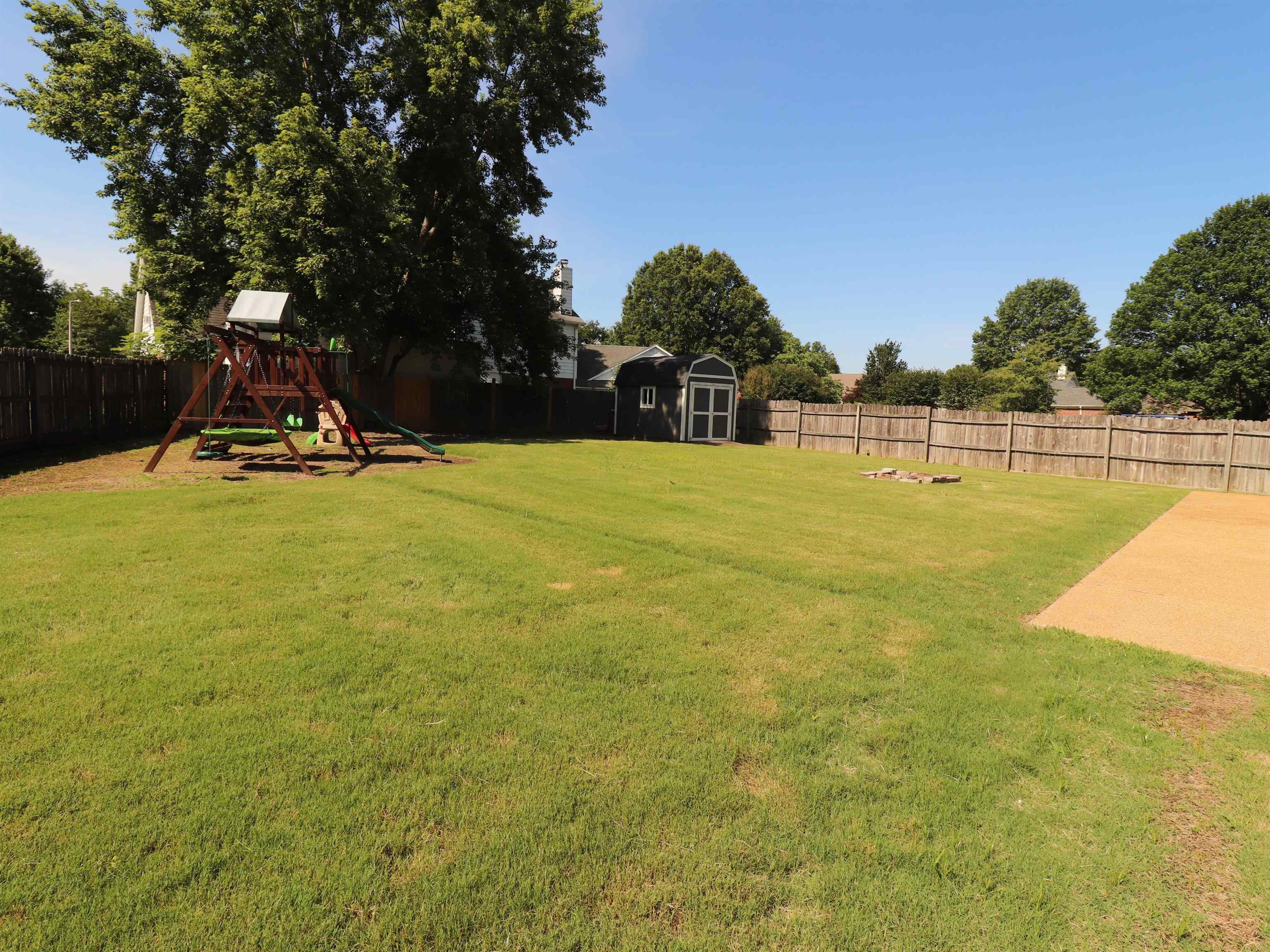 251 Cross Point Cove Collierville, TN 38017 - Photo 28 of 29 a view of a swimming pool with an outdoor space and seating area
