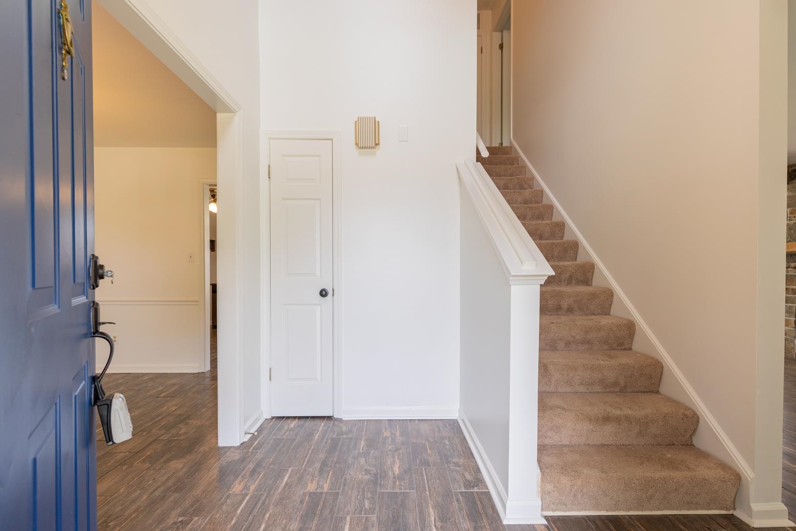 251 Cross Point Cove Collierville, TN 38017 - Photo 3 of 29 a view of a hallway with wooden floor and staircase