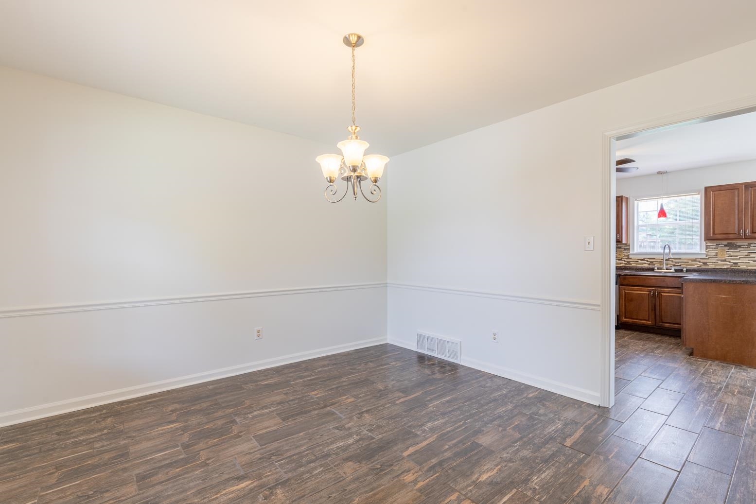 251 Cross Point Cove Collierville, TN 38017 - Photo 4 of 29 a view of a kitchen with a dishwasher and a stove top oven