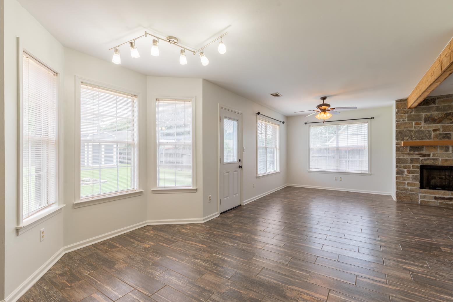 251 Cross Point Cove Collierville, TN 38017 - Photo 9 of 29 a view of an empty room with a window and wooden floor