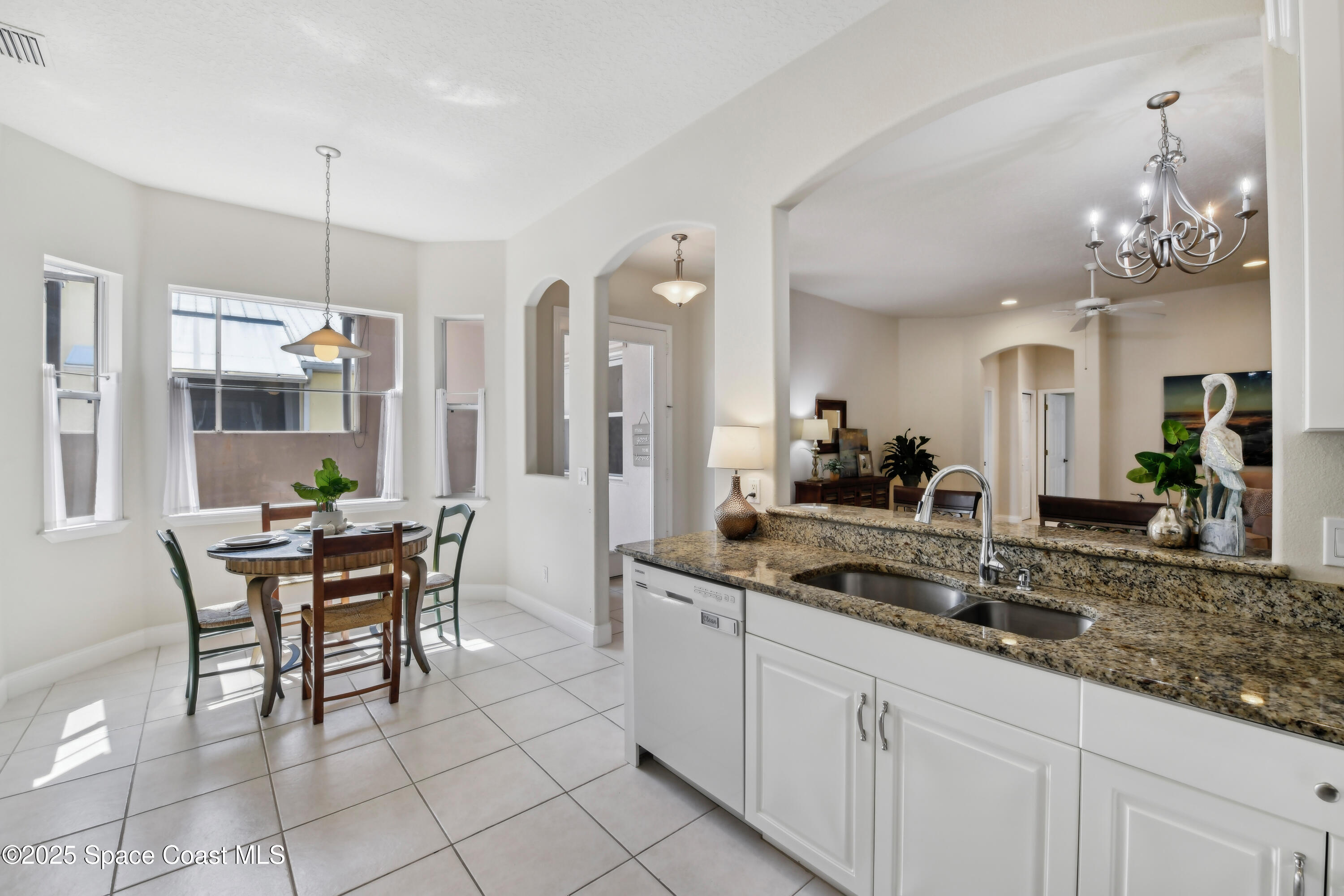 4040 Alamanda Key Drive Melbourne, FL 32901 - Photo 46 of 46 a kitchen with a table and chairs in it