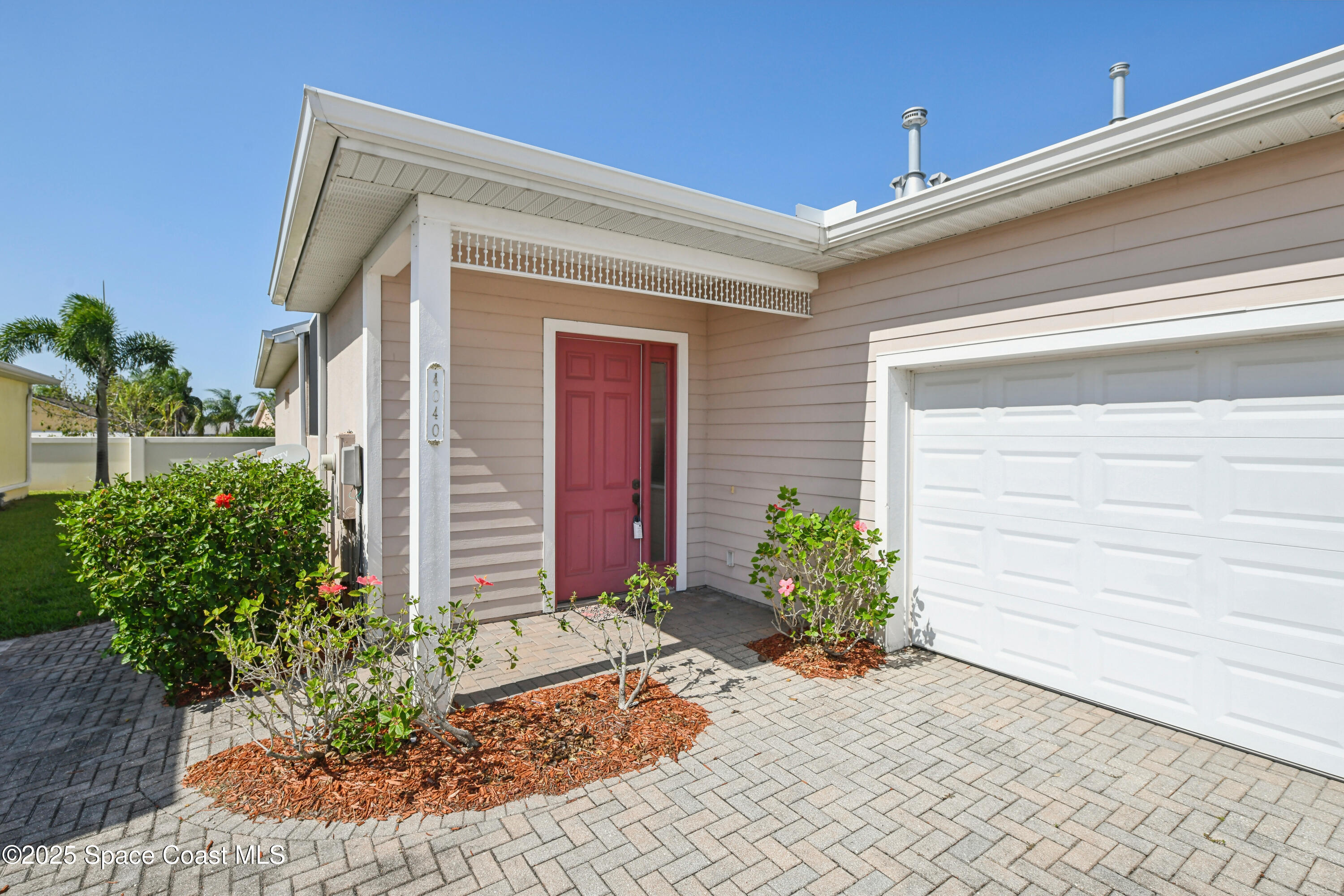 4040 Alamanda Key Drive Melbourne, FL 32901 - Photo 2 of 46 a view of a entryway door front of house