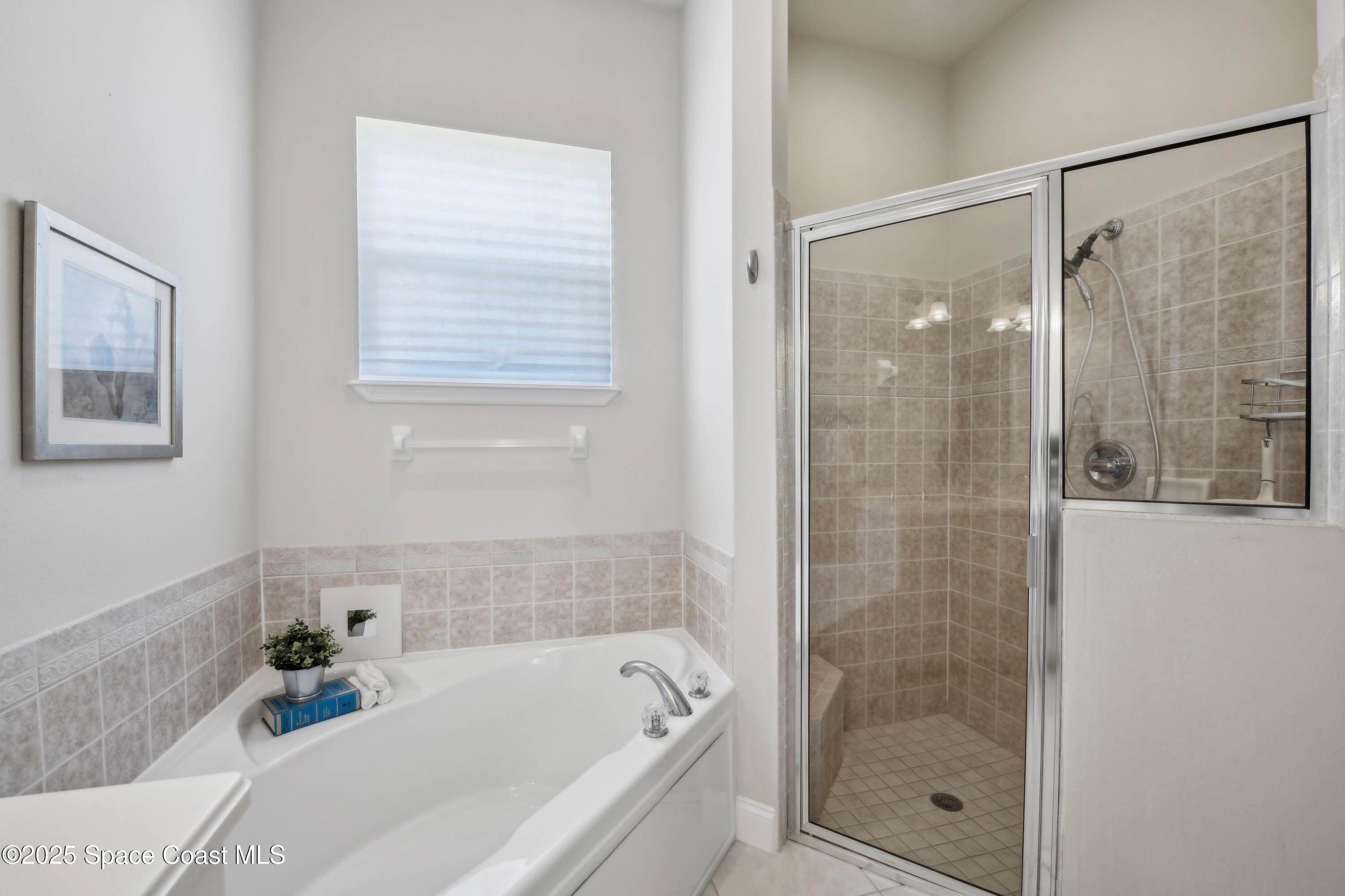 4040 Alamanda Key Drive Melbourne, FL 32901 - Photo 20 of 46 a bathroom with a bathtub and shower