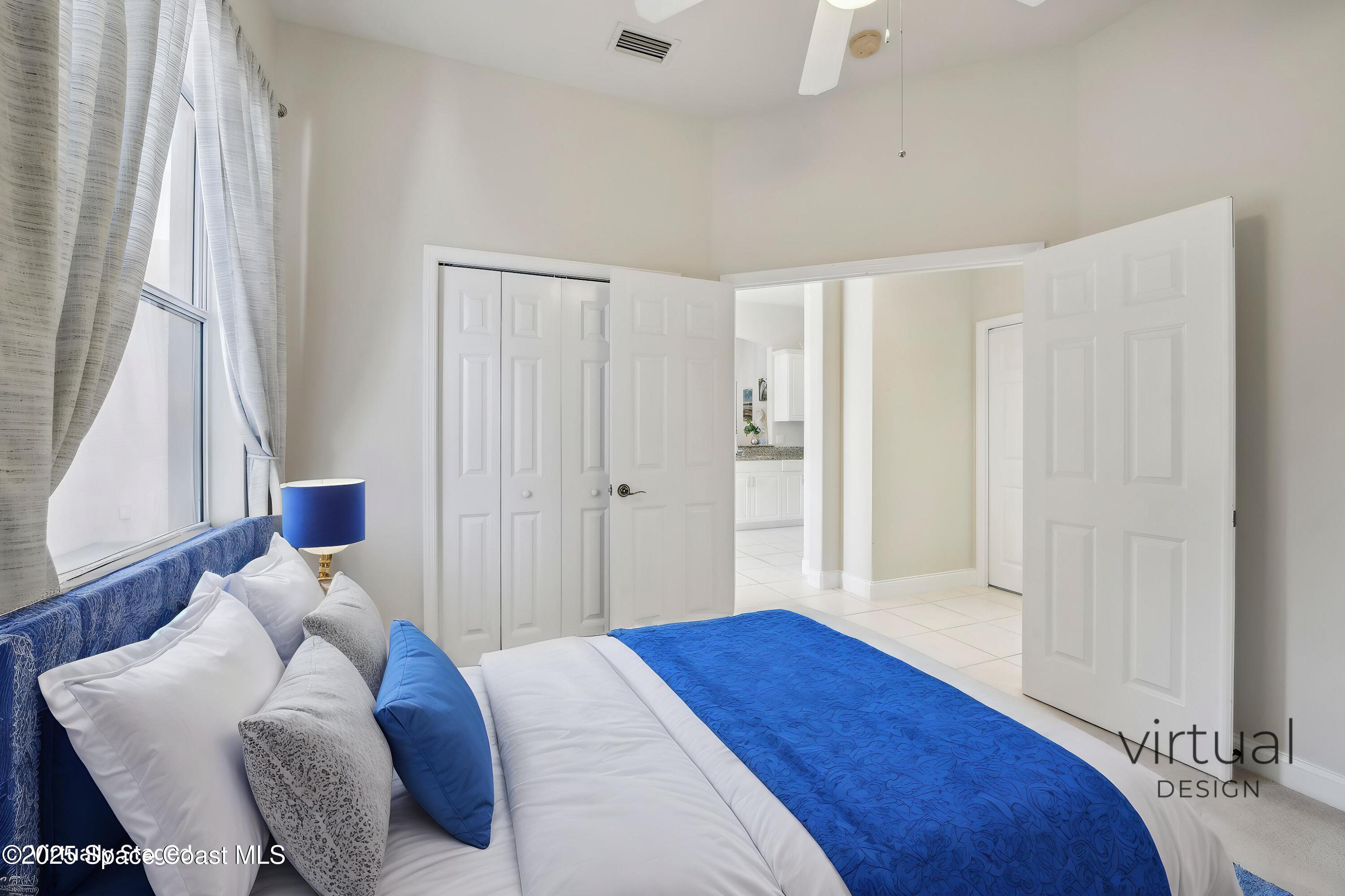 4040 Alamanda Key Drive Melbourne, FL 32901 - Photo 25 of 46 a bedroom with a bed and a window