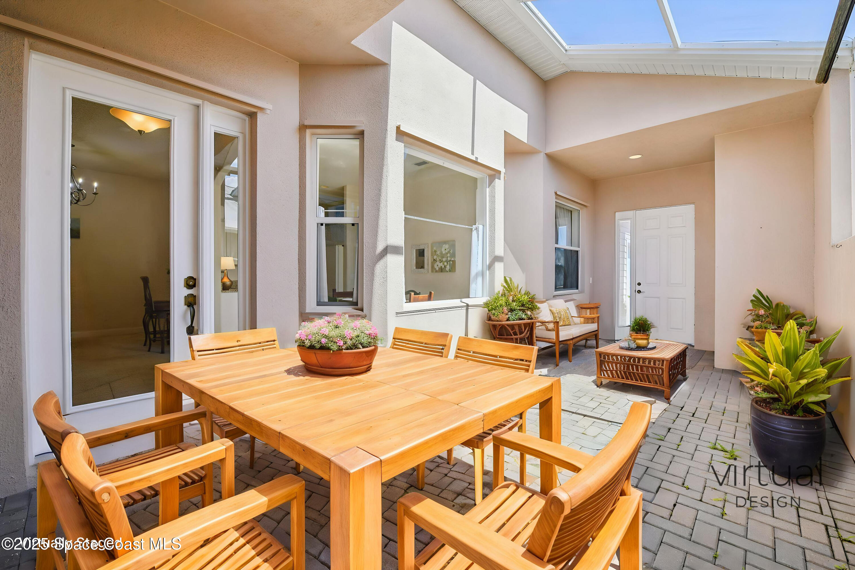 4040 Alamanda Key Drive Melbourne, FL 32901 - Photo 3 of 46 a view of a dining room with furniture and wooden floor