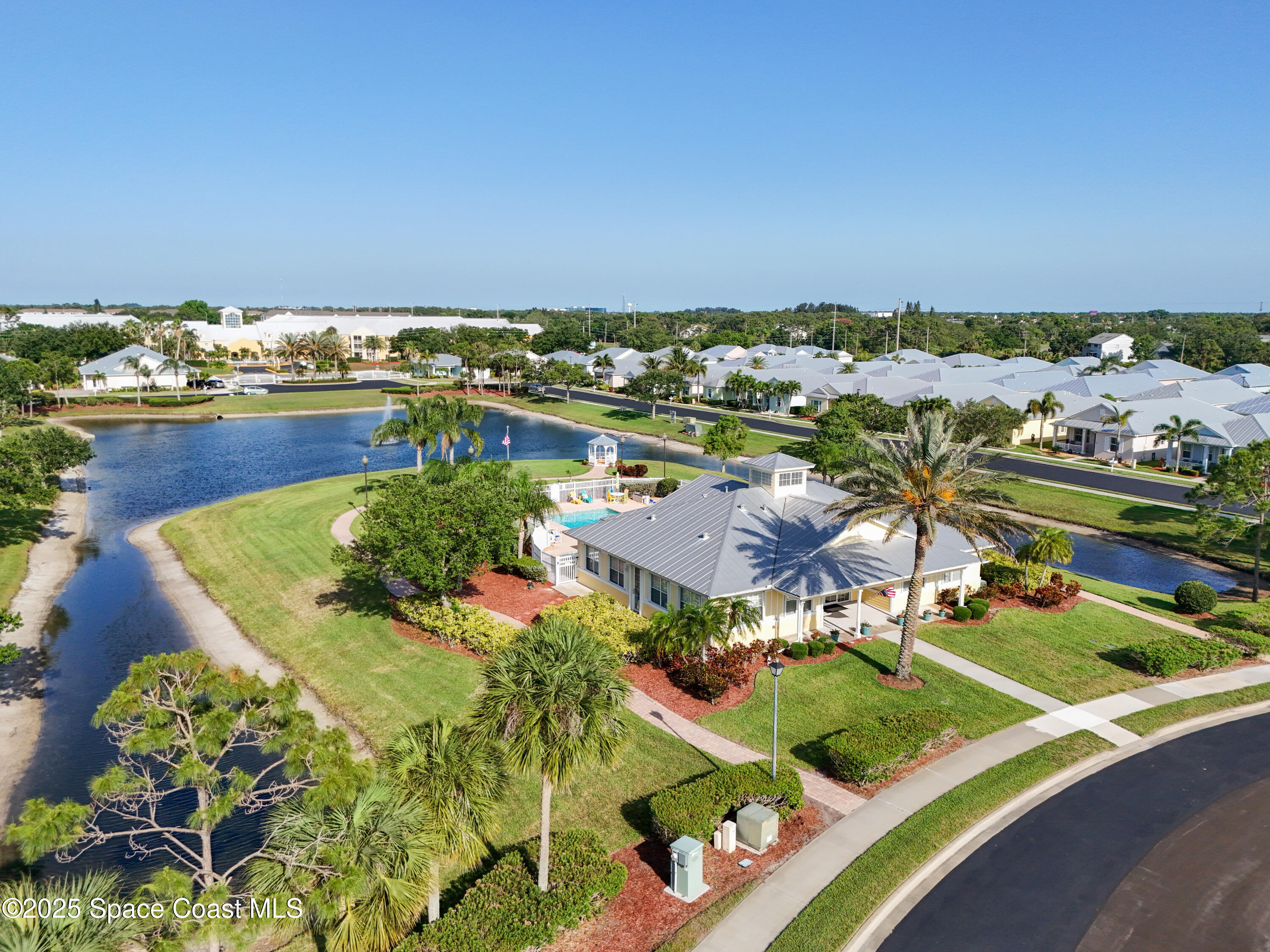 4040 Alamanda Key Drive Melbourne, FL 32901 - Photo 38 of 46 an aerial view of a houses with a lake view