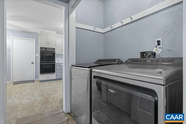 a utility room with washer and dryer