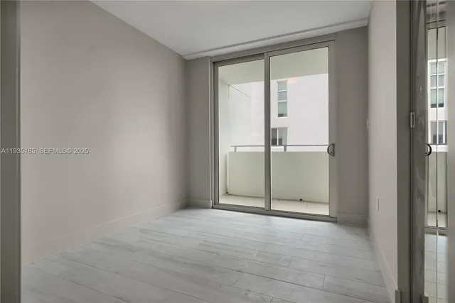 an empty room with sliding door