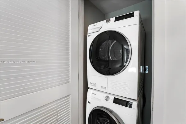 a front view of a building with a garden