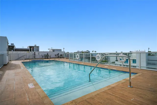 a view of a balcony with floor to ceiling windows