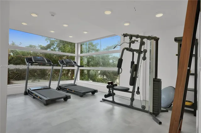 a view of a hall with floor to ceiling window