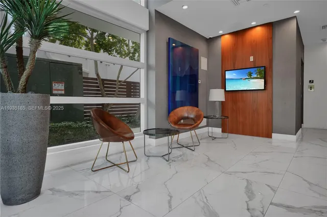a backyard of a house with seating space and potted plants