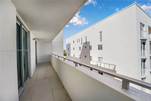 a view of a kitchen with a sink and cabinets