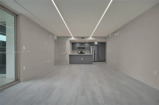 a big room with closet and windows