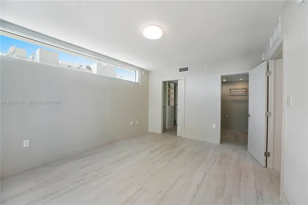 a view of an empty room and window