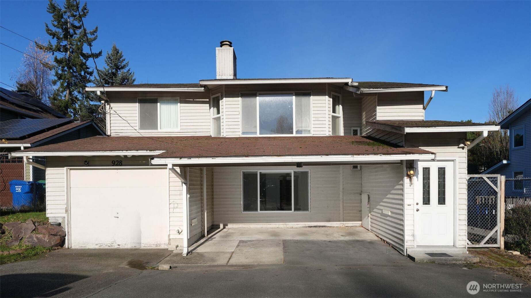 a front view of a house with a garage