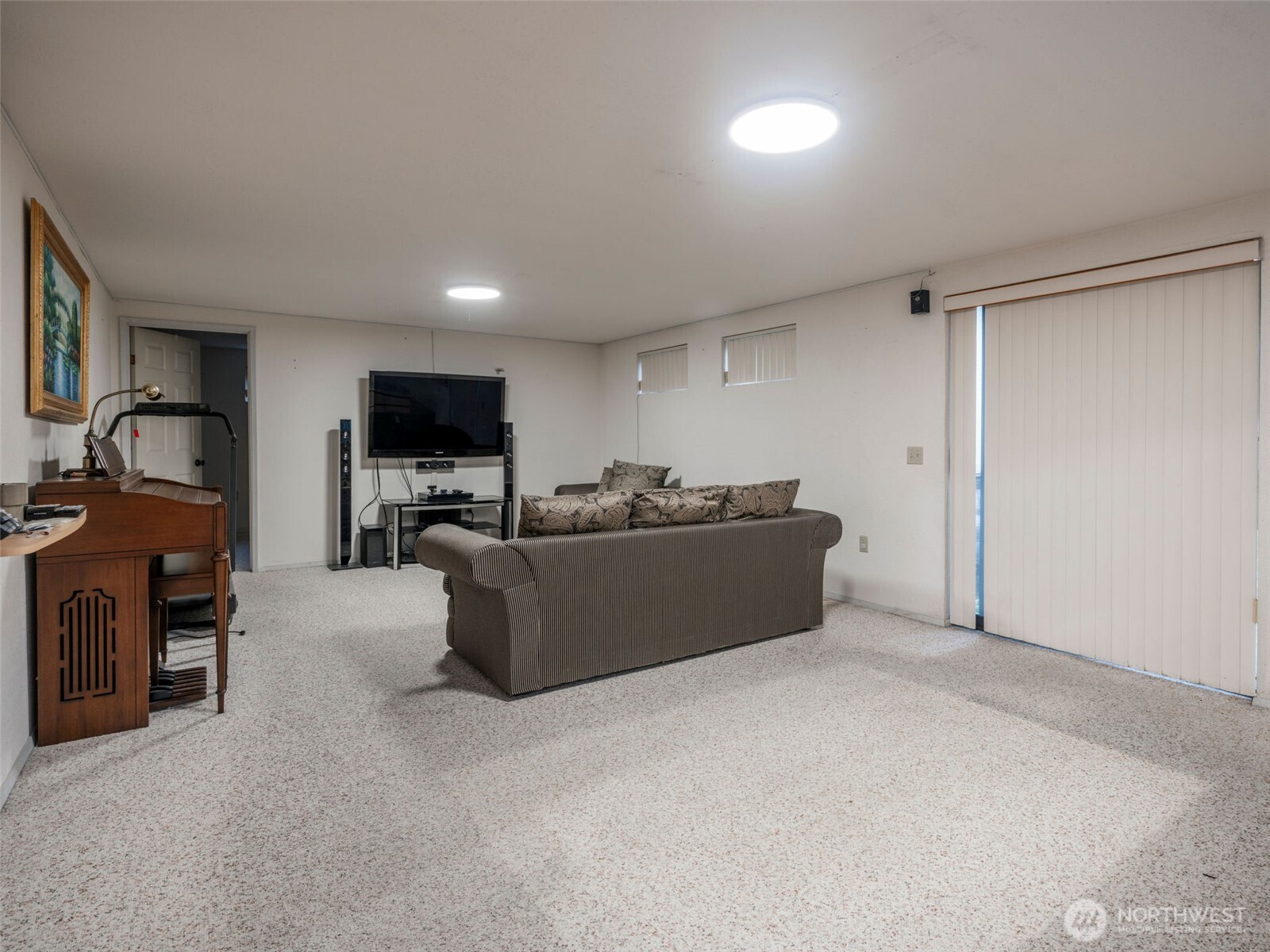 928 North 98th Street Seattle, WA 98103 - Photo 11 of 16 a living room with furniture and a flat screen tv