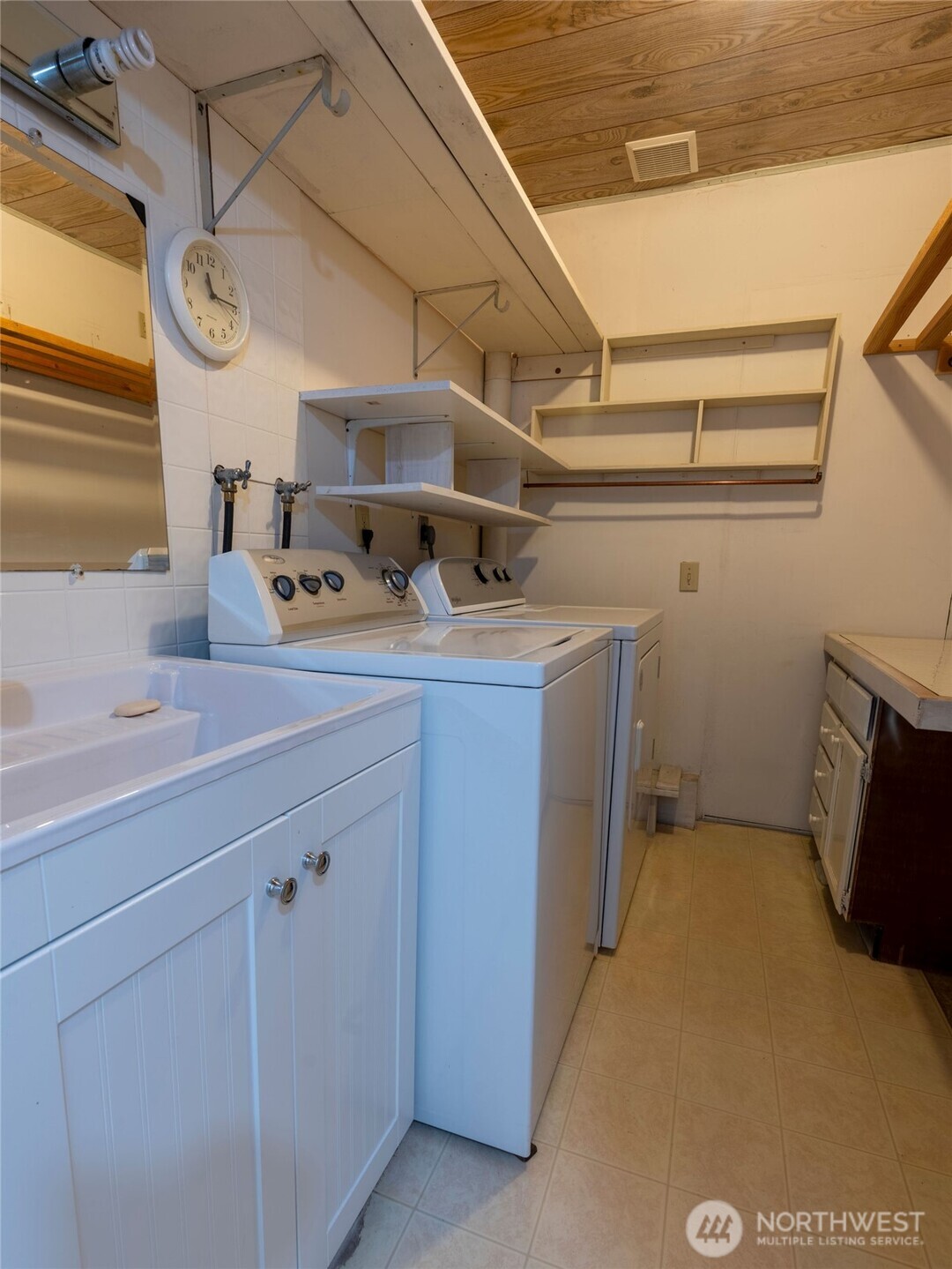 928 North 98th Street Seattle, WA 98103 - Photo 17 of 17 a utility room with dryer and washer