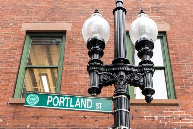 a close view of a chandelier fan and wooden floor
