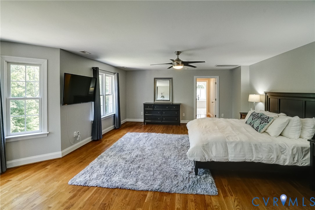 1295 Hermitage Road Manakin-Sabot, VA 23103 - Photo 39 of 55 a bedroom with a bed and wooden floor