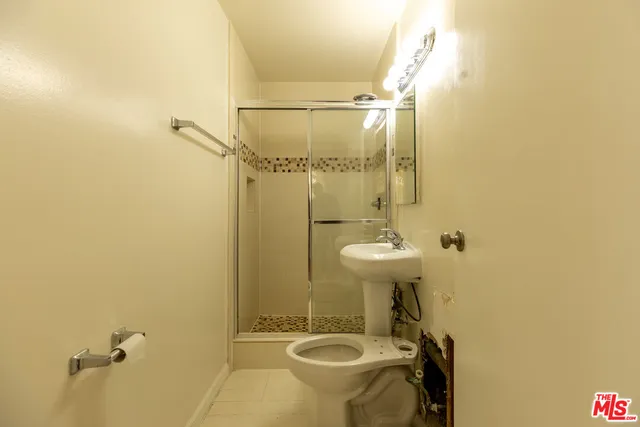 a bathroom with a sink and mirror