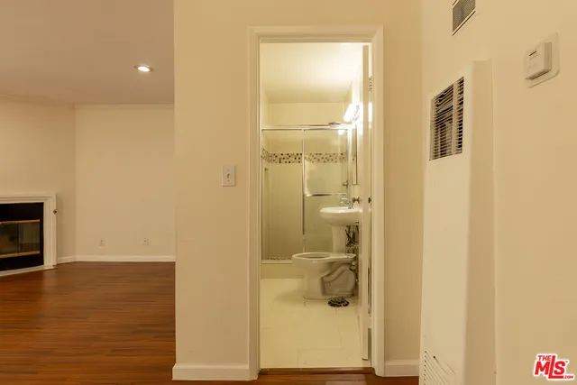 a bathroom with a shower and a sink