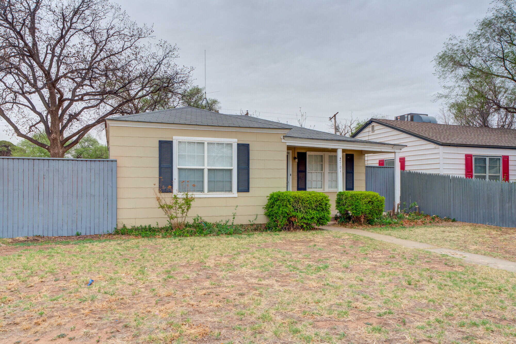 2701 36th Street Lubbock, TX 79413 - Photo 2 of 23 a front view of house with yard and trees around
