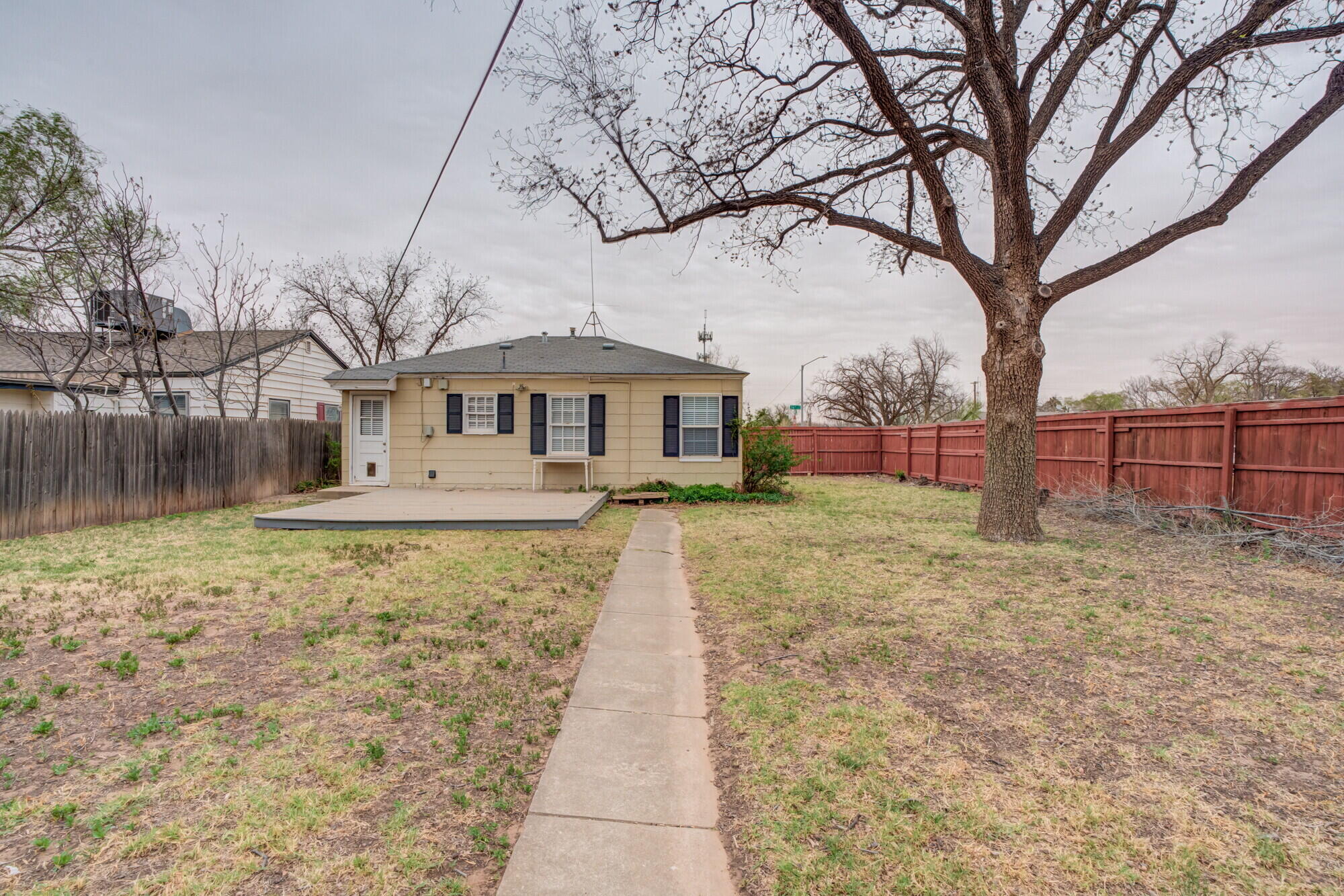 2701 36th Street Lubbock, TX 79413 - Photo 22 of 23 a front view of a house with a yard