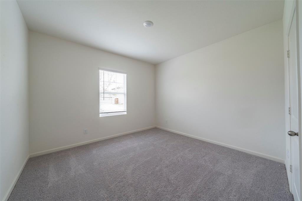 1838 Mccree Street Forney, TX 75126 - Photo 13 of 33 an empty room with a window